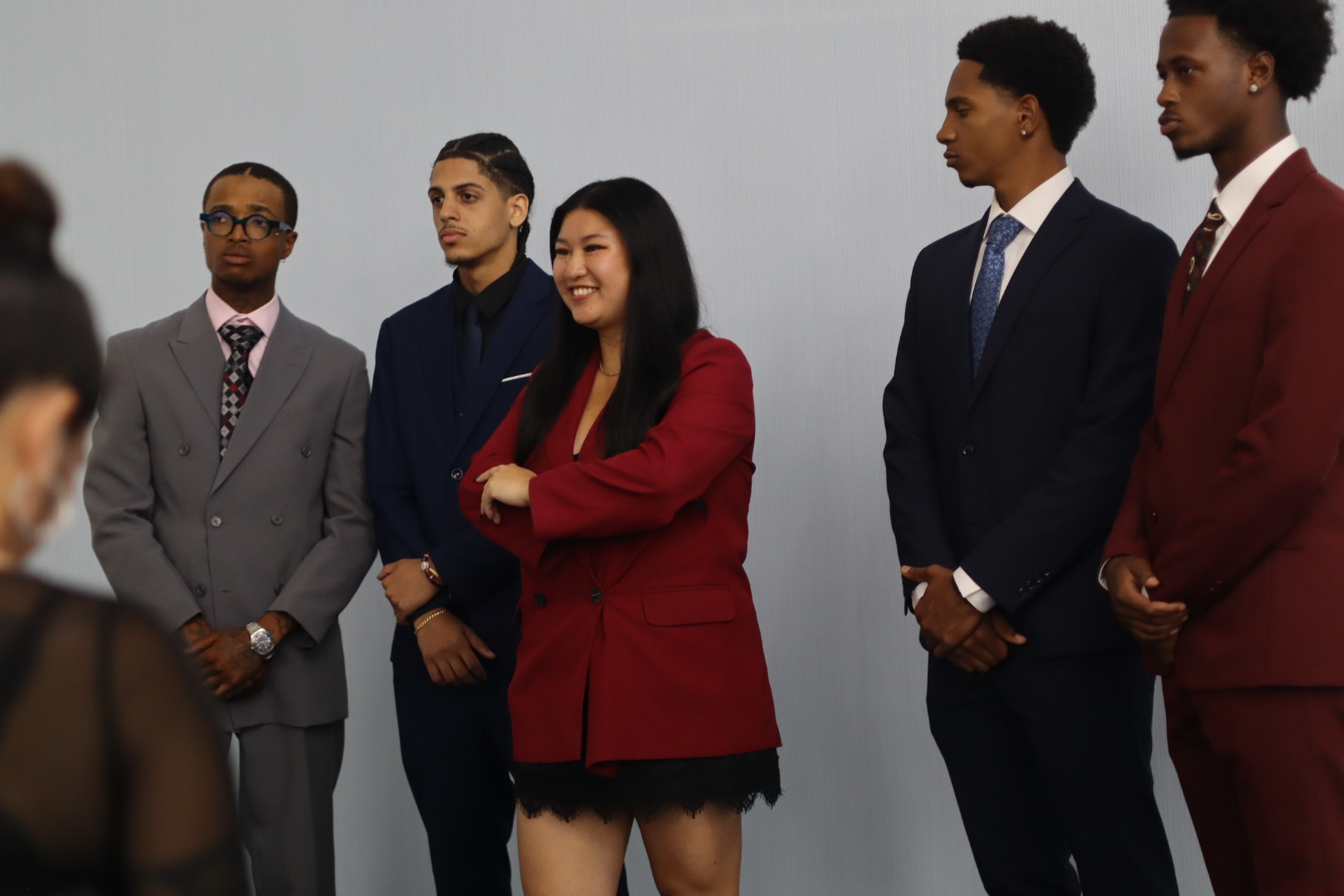 The 917 Collective team in suits, standing together before a session